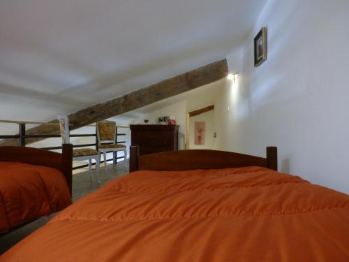 Katil atau katil-katil dalam bilik di Gîte Coqueliquot Domaine de l'Annonciade