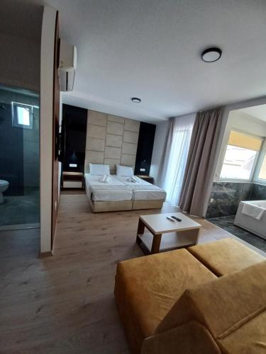 a large living room with a bed and a couch at RIBAR APARTMENTS in Ohrid