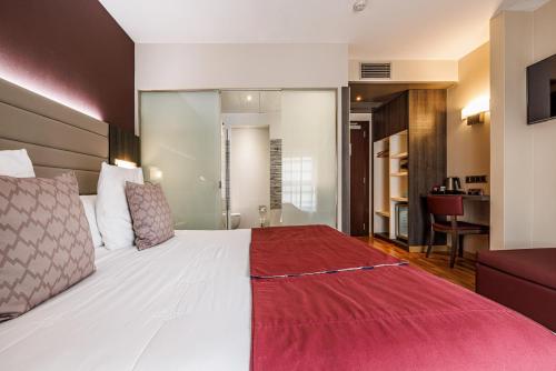 Ένα ή περισσότερα κρεβάτια σε δωμάτιο στο Hotel Ronda Lesseps