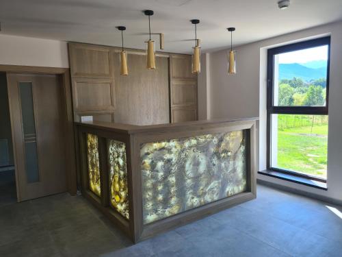 a large aquarium in a room with a window at New Wolf in Bran