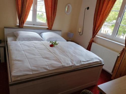 Ένα ή περισσότερα κρεβάτια σε δωμάτιο στο Hotel Rosengarten