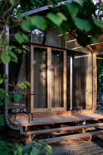a wooden house sitting on a wooden platform at les Cabanes d'Ostende in Ostend