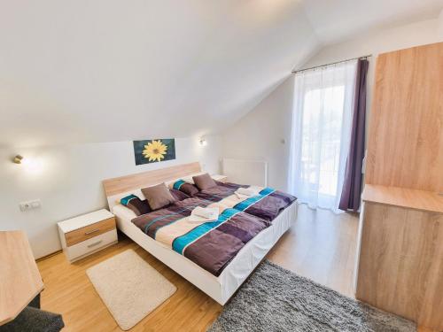 Postel nebo postele na pokoji v ubytování Duna-Beach Apartman