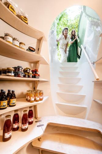 a bride and groom standing on the stairs of a refrigerator at les Cabanes d'Ostende in Ostend