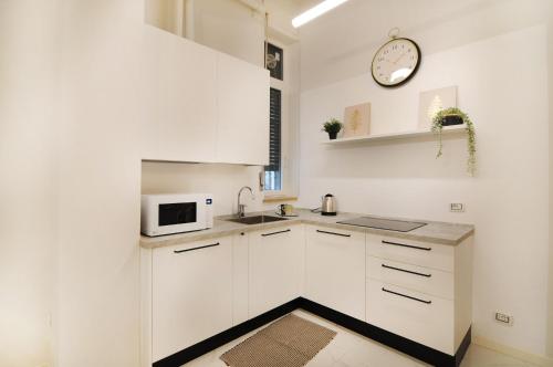 Cuisine ou kitchenette dans l'établissement Dimore Verona