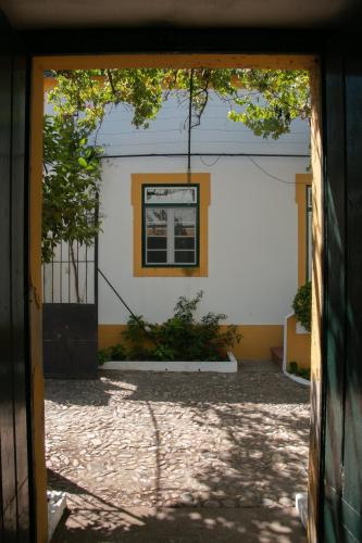 an open door to a building with a window at Quinta de SantAna da Várzea in Abrantes