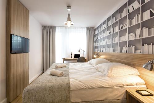 Posteľ alebo postele v izbe v ubytovaní Smart Hotel