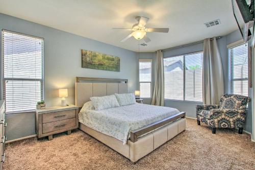 a bedroom with a bed and a ceiling fan at North Phoenix Home with Community Pools! in Anthem
