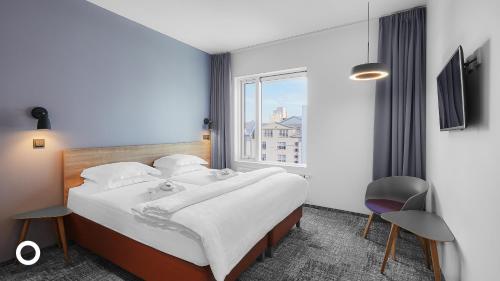 Postel nebo postele na pokoji v ubytování Midgardur by Center Hotels