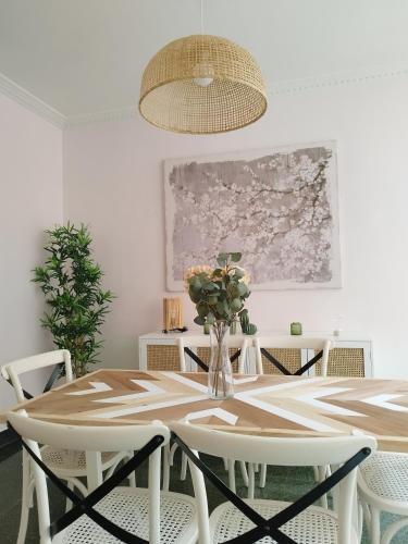 a dining room with a table and chairs at Railway by Staynnapartments in Bilbao