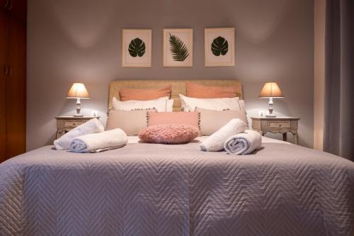 a bedroom with a bed with pillows on it at Sevi's Luxury Guesthouse Villa in Ioannina
