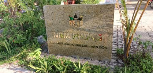 a sign for a new york city cemetery at Quan Lan Nam Phong Hotel in Quan Lạn