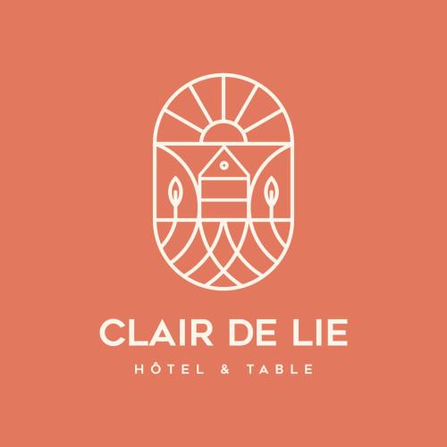 a logo for a hotel and table at Clair de Lie in Vallet