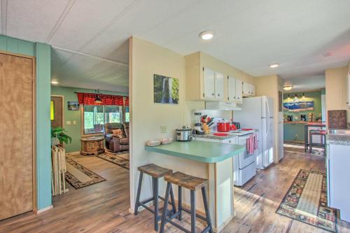 a kitchen with a counter and a refrigerator at Cozy Chiloquin Retreat Less Than 30 Mi to Crater Lake! in Chiloquin