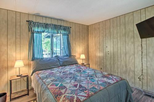 a bedroom with a bed and a window at Cozy Chiloquin Retreat Less Than 30 Mi to Crater Lake! in Chiloquin