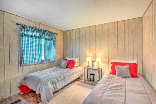 a bedroom with two beds and a window at Cozy Chiloquin Retreat Less Than 30 Mi to Crater Lake! in Chiloquin