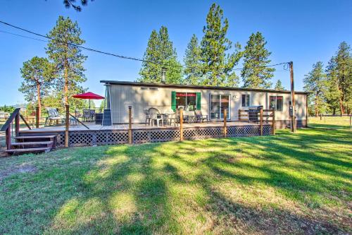 a small house with a porch and a playground at Cozy Chiloquin Retreat Less Than 30 Mi to Crater Lake! in Chiloquin
