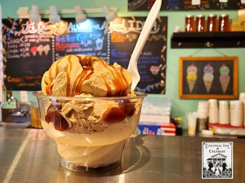 a ice cream sundae sitting on a counter at The Colonial Inn & Creamery in Watkins Glen