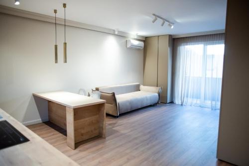 a living room with a couch and a table at Opera Apartments in Cluj-Napoca