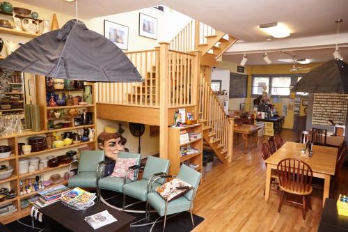 a person sitting in a chair in a restaurant at Ray's Bucktown Bed and Breakfast in Chicago
