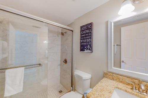 a bathroom with a shower and a toilet and a sink at Huntington by the Sea 201 Miramar Beach (Condo) in Destin