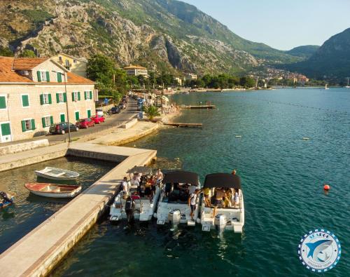 a group of people on a boat in the water at Montenegro Hostel 4U in Kotor