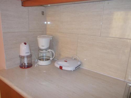 a counter with a blender and a toaster on it at Sapera Evdokia in Filiatra