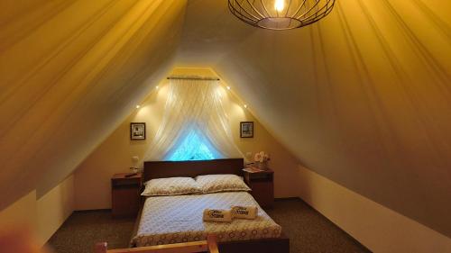 a bedroom with a bed in a attic at Willa Sternik in Hel