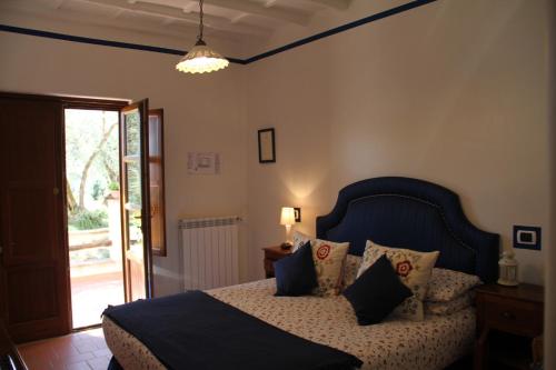 Ένα ή περισσότερα κρεβάτια σε δωμάτιο στο B&B Il casale dei gechi