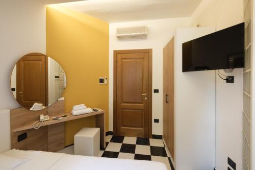 TV a/nebo společenská místnost v ubytování Hotel Ristorante Alla Vittoria