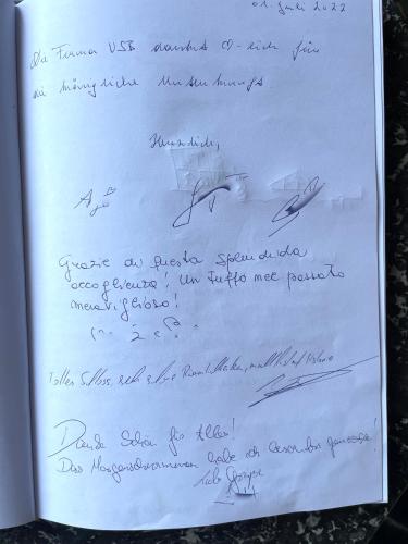 a letter with handwriting on a white paper at Schloss Moosburg Gästehaus in Moosburg