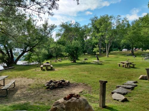 a park with picnic tables and a fire pit at Mountain Retreat in Wilmington