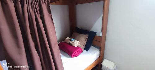 Easy Quartos Floripaにあるベッド