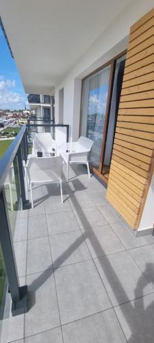 En balkon eller terrasse på APARTAMENT MORZA SZUM