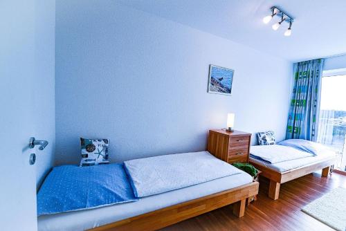 Ένα ή περισσότερα κρεβάτια σε δωμάτιο στο Haus Nordseebrandung NA61