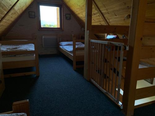 a room with two bunk beds and a window at Rekreační pobyt in Tichá