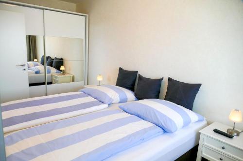 Cama ou camas em um quarto em Haus Frische Brise 1312