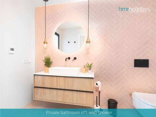 a bathroom with a sink and a mirror at Villa Milana by HMR Holidays in Moraira