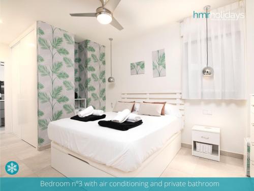 a bedroom with air conditioning and private bedroom at Villa Milana by HMR Holidays in Moraira