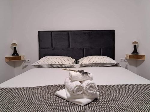 A bed or beds in a room at Apartman Megolina