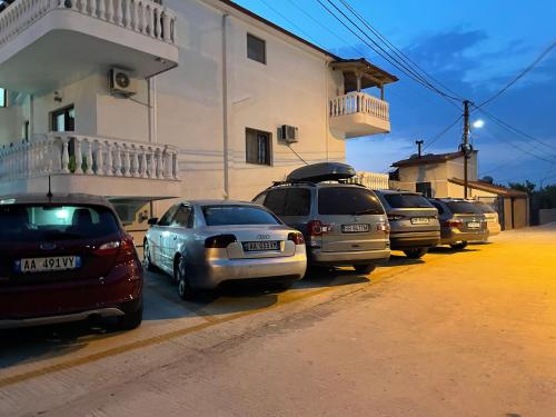 a row of cars parked next to a building at Summer Dreams in Ksamil
