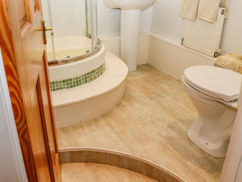 a bathroom with a toilet and a shower at Little London in Battle