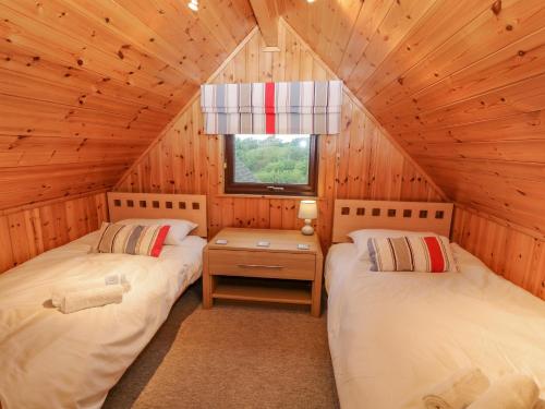 מיטה או מיטות בחדר ב-Lodge 16