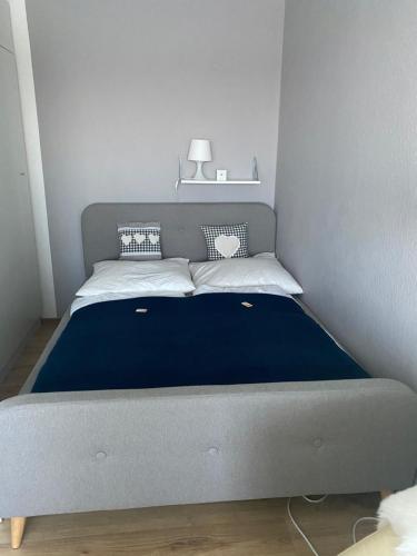 a bed in a small room with a blue mattress at Julia in Sankt Andreasberg