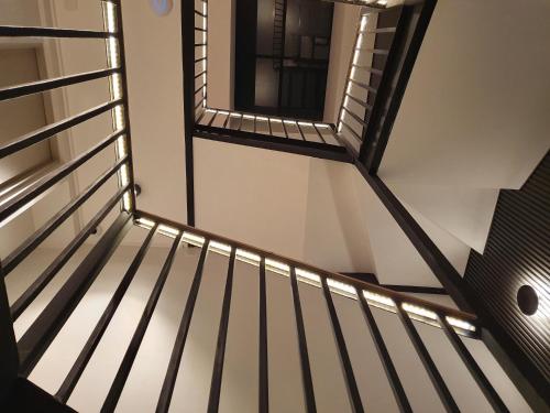 a view from the top of a stairs with a window at Lastarria Hotel in Santiago