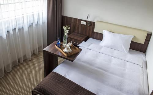 Hotel Antonio Conferenceにあるベッド