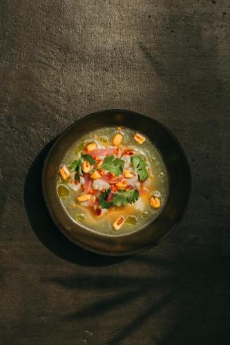 a plate of food on a table at White Exclusive Suites & Villas in Lagoa