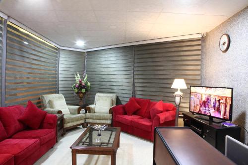 Zona de estar de Al Dyafah Hotel Apartments