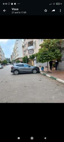 a car parked on the side of a street at Appartement in Taza