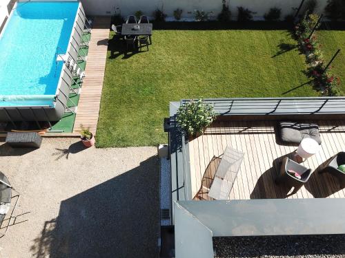 an overhead view of a backyard with a swimming pool at Lodge Marie in Villegailhenc